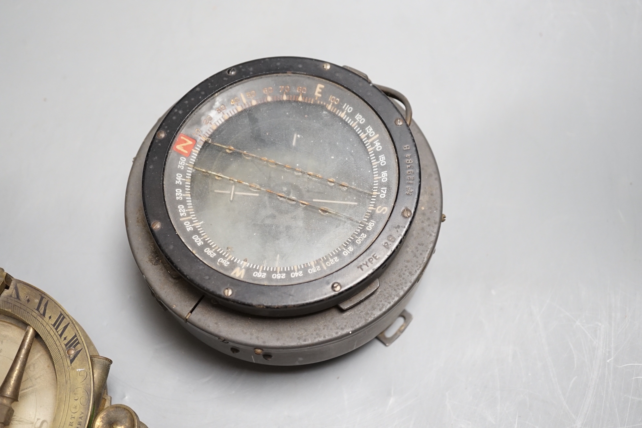A 19th century Herbert & Co. brass compass and another WWII compass